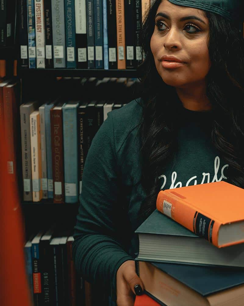 girl holding books